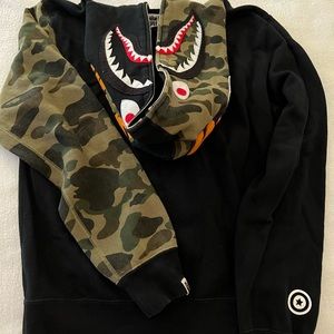 A Bathing Ape- World gone mad 1993-2093. Black sweatshirt with design.